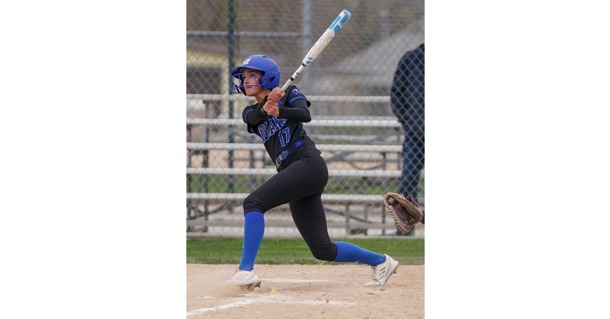 MCC freshman Anna Elliott watches her hit sail over the fence in Game 1 Friday as MCC beat Western Nebraska 10-2